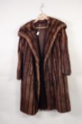 LADY'S BROWN MINK FULL-LENGTH COAT with broad revered collar and hook fastening front and LADY'S