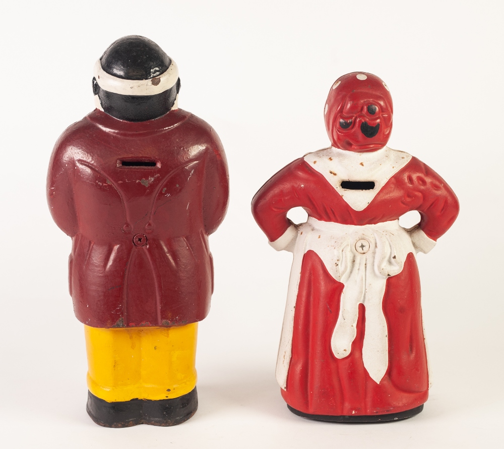 A PAIR OF TWENTIETH CENTURY PAINTED CAST MONEY BANKS, standing figures of Negro man and woman, he - Image 2 of 2