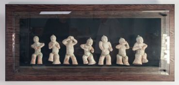 A WELL PRESENTED SUITE OF SEVEN COMPOSITION REPLICA CHINESE TANG STYLE FIGURES in broad wooden