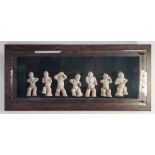 A WELL PRESENTED SUITE OF SEVEN COMPOSITION REPLICA CHINESE TANG STYLE FIGURES in broad wooden