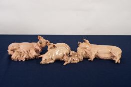FOUR HEREDITIES 'The Charm of Cream Ware' POTTERY MODELS OF LARGE WHITE PIGS, viz a group with