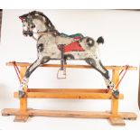 MID CHILD'S TRIANG MEDIUM SIZED CARVED AND PAINTED WOOD PLATFORM ROCKING HORSE, with leather tack