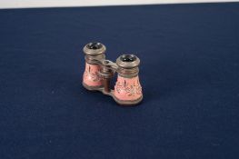 PAIR OF BRASS AND ENGRAVED PINK ENAMELLED OPERA GLASSES, in fabric purse
