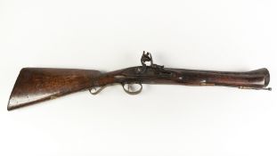 19th CENTURY FLINTLOCK BLUNDERBUSS OF CRUDE CONSTRUCTION with oak, full stocked, typical barrel,