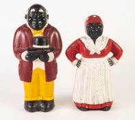 A PAIR OF TWENTIETH CENTURY PAINTED CAST MONEY BANKS, standing figures of Negro man and woman, he