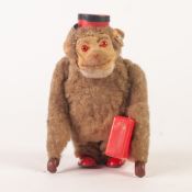 M.B. WEST GERMANY CIRCA 1950's CLOCKWORK MONKEY, felt, plush fabric, tinplate and plastic, walking