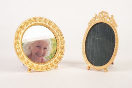 MODERN ORMOLU CIRCUALR EASEL PHOTOGRAPH FRAME, with laurel wreath pattern border, 5 3/4" (14.5cm)