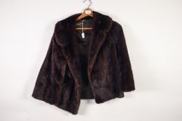 LADY'S DARK BROWN MINK SHORT EVENING JACKET with broad revered collar and broad sleeves, double-