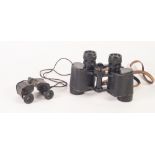 A LEATHER CASED PAIR OF BINOCULARS, and a SMALLER PAIR DITTO (2)