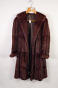 LADY'S BROWN DYED ERMINE FULL-LENGTH FUR COAT with long shawl collar, cuffs, hook fastening front