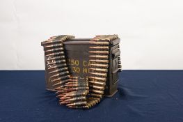 GREEN METAL TWO HANDLE AMMUNITION TIN, containing a BELT OF 7.62 CALIBRE INERT AMMUNITION for a belt