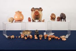 THREE CERAMIC PIG MONEY BOXES, FIVE VARIOUS PIG SHAPED ITEMS AND 26 MINIATURE PIG ORNAMENTS (34)