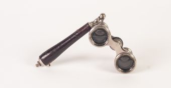 A PAIR OF EARLY TWENTIETH CENTURY OPERA GLASSES with folding handle