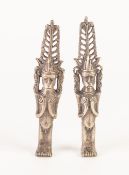 POSSIBLY AFRICAN, PAIR OF CAST WHITE METAL FERTILITY FIGURES, each modelled standing with