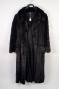 LADY'S LONG, FULL-LENGTH BLACK MINK COAT with broad revered collar, double-breasted with buttons b