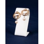 PAIR OF RED GOLD DOUBLE TWIST CIRCLE CLIP EARRINGS, the two circles of each linked by a gold band at