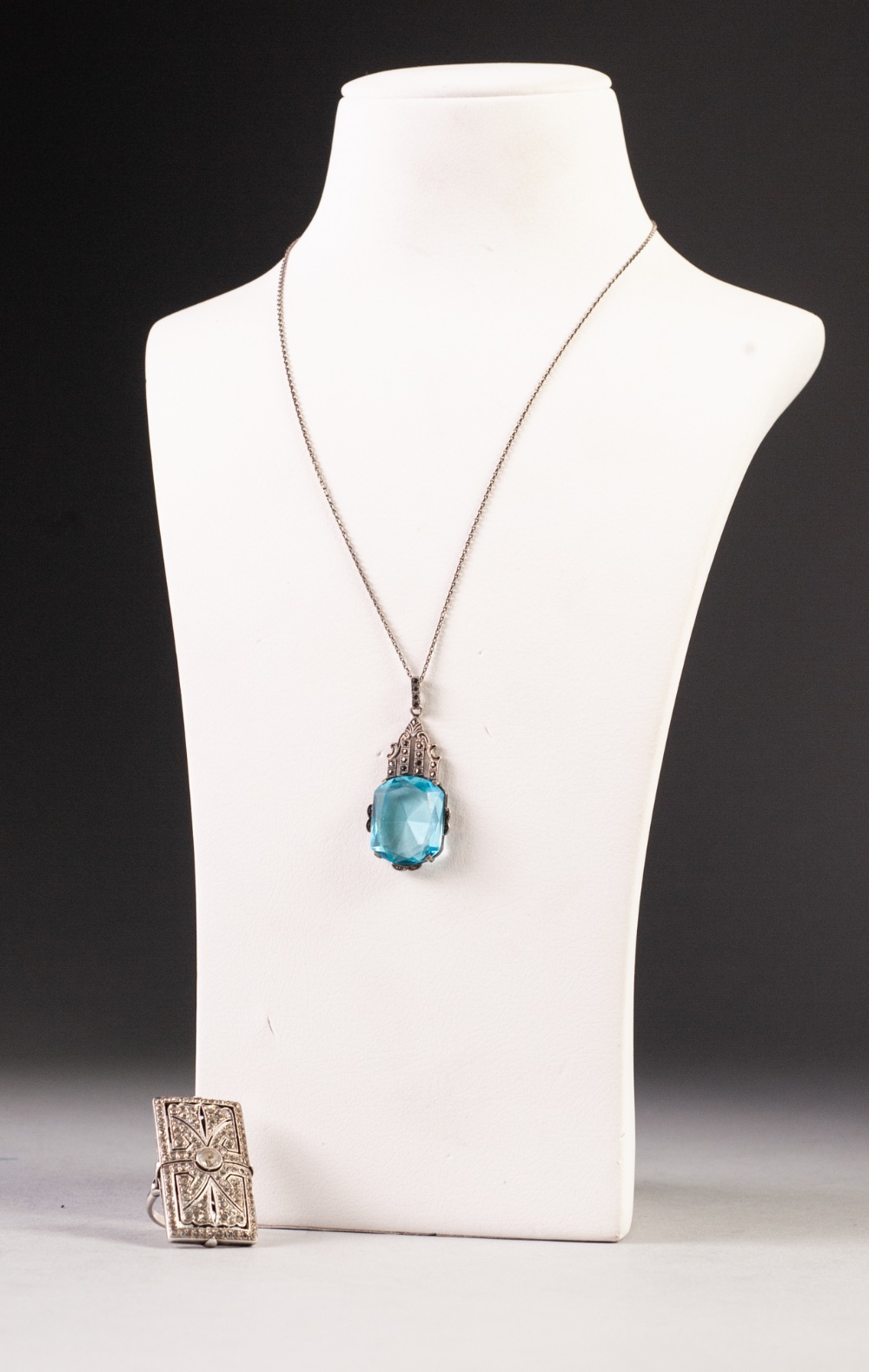 ART DECO MARCASITE PENDANT, set with a large rectangular blue stone on a fine chain necklace and