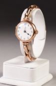 LADY'S 9ct GOLD WRIST WATCH, with Swiss movement, white porcelain Arabic dial, circular case with