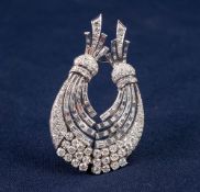 WHITE GOLD AND DIAMOND DOUBLE CLIP BROOCH COMPOSED OF TWO CURVING SPRAYS SET WITH BRILLIANT,