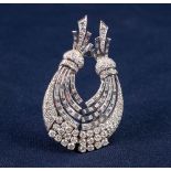 WHITE GOLD AND DIAMOND DOUBLE CLIP BROOCH COMPOSED OF TWO CURVING SPRAYS SET WITH BRILLIANT,