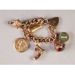 9ct GOLD HEAVY CURB PATTERN CHARM BRACELET, with padlock clasp and five 9ct gold charms viz a violin