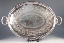 IMPRESSIVE TWO HANDLED ELECTROPLATED TEA TRAY BY ELKINGTON & Co, of oval form with scroll engraved