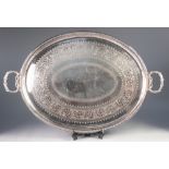 IMPRESSIVE TWO HANDLED ELECTROPLATED TEA TRAY BY ELKINGTON & Co, of oval form with scroll engraved