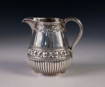 GOOD QUALITY VICTORIAN SILVER CREAM JUG, the pear shaped body demi-gadrooned and embossed with