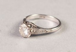 PLATINUM RING WITH A ROUND BRILLIANT CUT SOLITAIRE DIAMOND in eight claw setting, eight tiny