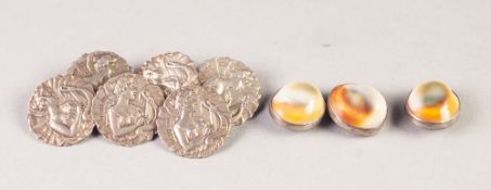 A SET OF SIX EDWARDIAN ART NOUVEAU EMBOSSED SILVER BUTTONS, featuring a Grecian maiden playing a