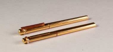 A MATCHED PAIR OF MODERN CARTIER (PARIS) GOLD PLATED FOUNTAIN AND BALLPOINT PENS, serial numbers