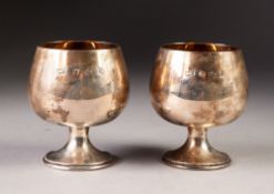 PAIR OF SILVER BRANDY BALLOONS on short waisted stems and stepped circular bases, gilt interiors,