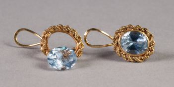 PAIR OF GOLD COLOURED METAL OVAL ROPE PATTERN EARRINGS each set with a blue topaz, (tests as 14k