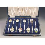 CASED SET OF SIX SILVER AND ENAMELLED COFFEE SPOONS, each enamelled to both sides of the handle