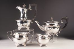 GEORGE V FOUR PIECE HEAVY QUALITY SILVER TEA SET BY WILLIAM HUTTON & SONS Ltd, of circular form with