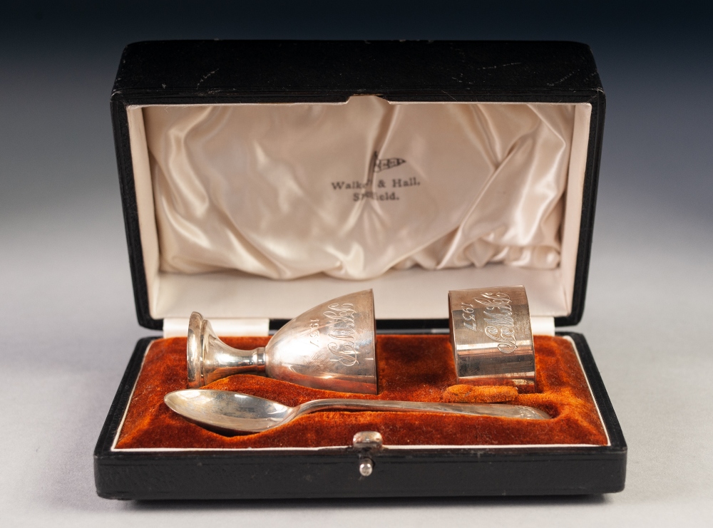 GEORGE VI CASED THREE PIECE SILVER CHRISTENING SET BY WALKER & HALL, comprising: EGG CUP, NAPKIN