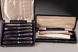 SET OF SIX AFTERNOON TEA KNIVES with silver handles, in case, Sheffield 1931 and A SHOE HORN AND