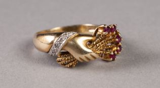 HALLMARKED GOLD RING, the top in the form of a hand extending from a sleeve with a cuff set with