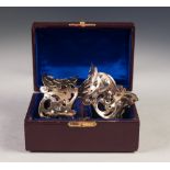 CASED PAIR OF LATE VICTORIAN PIERCED SILVER NAPKIN RINGS, of waisted form, London 1898, 2oz, in