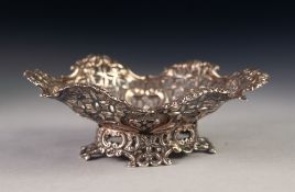 LATE VICTORIAN PIERCED SILVER BON BON DISH, of shaped oval form with embossed scroll centre and