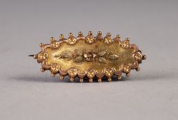 VICTORIAN 9ct THREE COLOUR GOLD LOZENGE SHAPED BROOCH, the centre applied with red gold bloom and