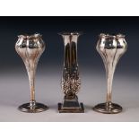 PAIR OF EDWARDIAN WEIGHTED SILVER TULIP FORM POSY VASES, Birmingham 1906 and a single weighted