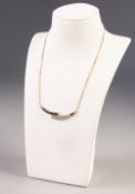 14ct GOLD NECKLACE with fine chain back, the solid cross over front set with a row of 11 small
