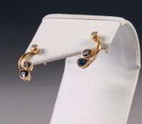 PAIR OF SPRAY SHAPED EARRINGS each set with a tiny diamond and two tear shaped sapphires