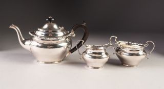 EDWARD VII BACHELORS THREE PIECE SILVER TEA SET BY ELKINGTON & Co, of plain oval form with cyma