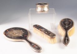 GEORGE V THREE PIECE SILVER PIQUET WORK DRESSING TABLE HAND MIRROR AND BRUSH SET, marks rubbed,
