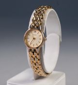 LADY'S ACCURIST QUARTZ GOLD PLATED BRACELET WATCH, the small circular silvered dial with batons, the