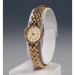 LADY'S ACCURIST QUARTZ GOLD PLATED BRACELET WATCH, the small circular silvered dial with batons, the