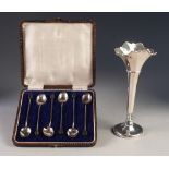 GEORGE V WEIGHTED SILVER TRUMPET VASE, of panelled form with raised, wavy rim and conforming foot,