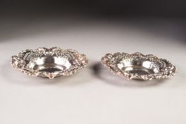 EDWARD VII PAIR OF PIERCED SILVER BON BON DISHES, each with plain. Dished centre and fancy scroll